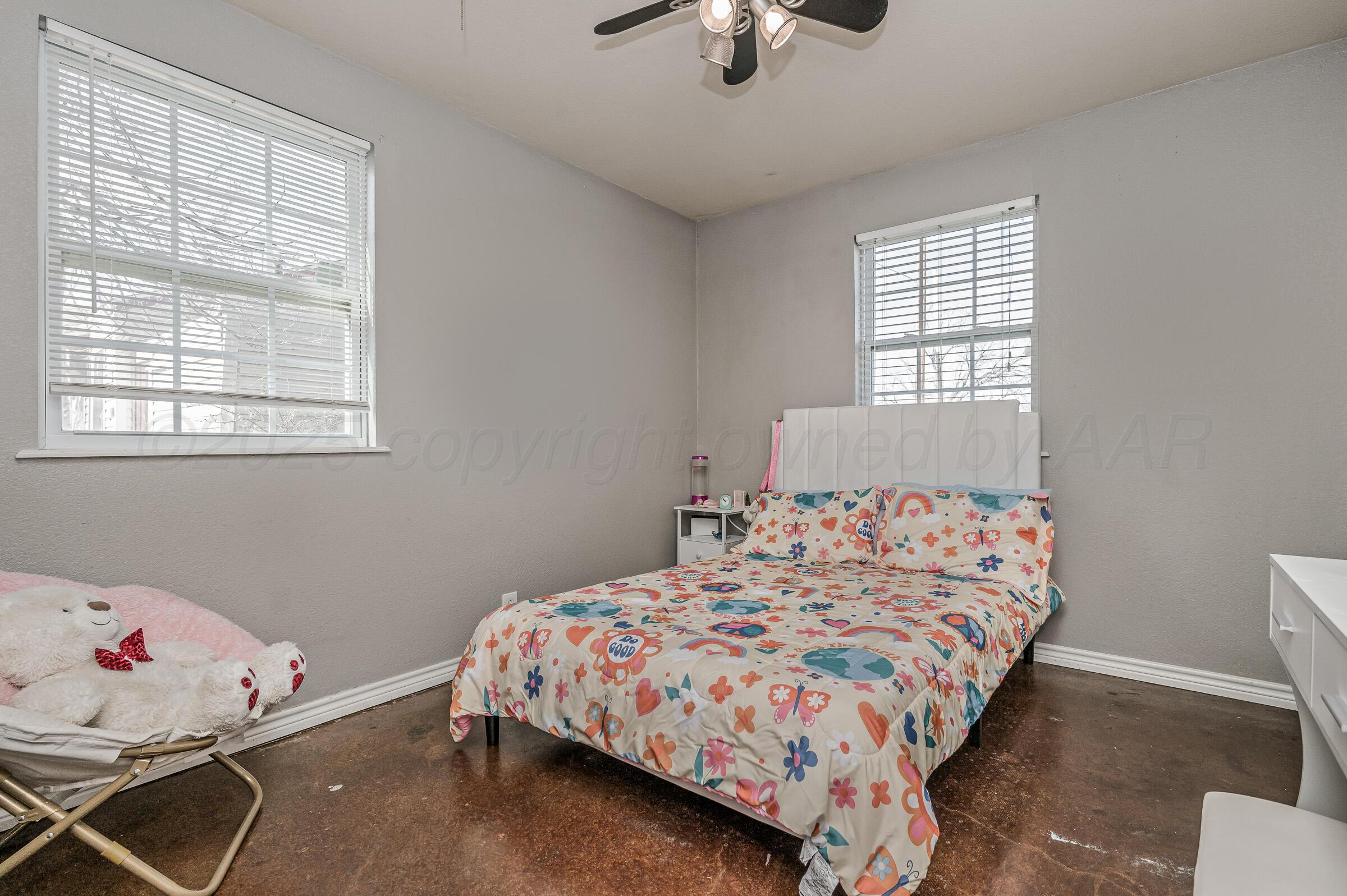 4351 South Tyler Street Amarillo, TX 79110 - Photo 14 of 18 a bedroom with a bed and window