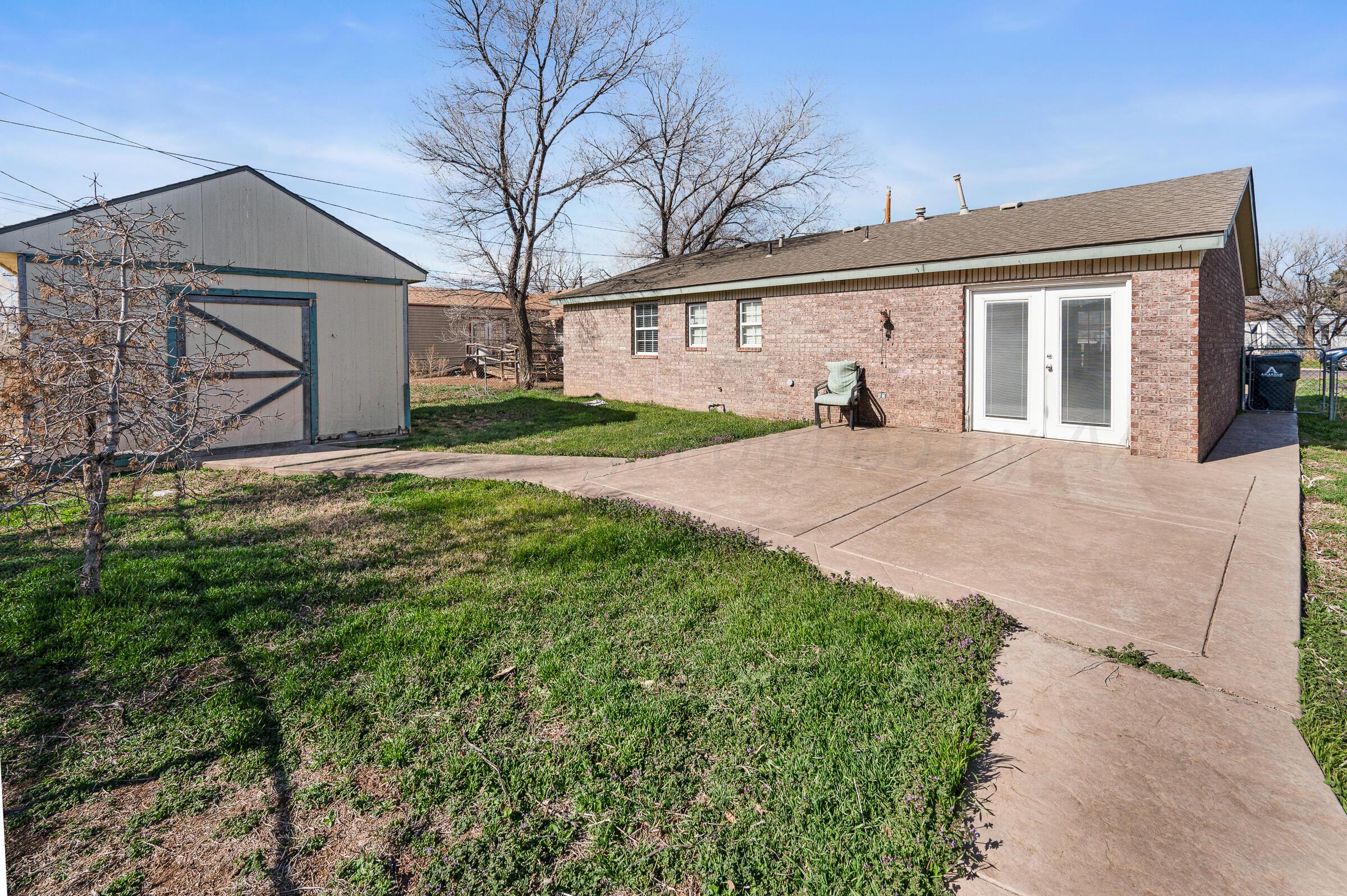 4351 South Tyler Street Amarillo, TX 79110 - Photo 17 of 18 front view of a house with a yard