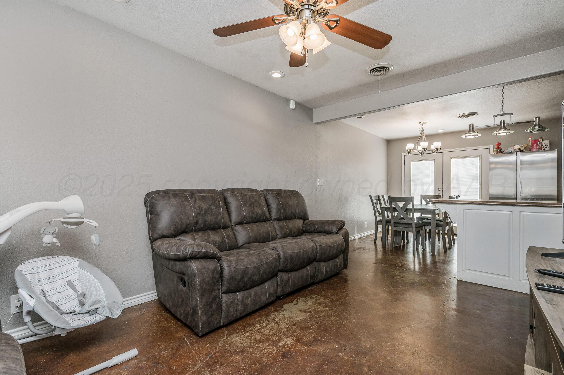 4351 South Tyler Street Amarillo, TX 79110 - Photo 5 of 18 a living room with furniture and a table
