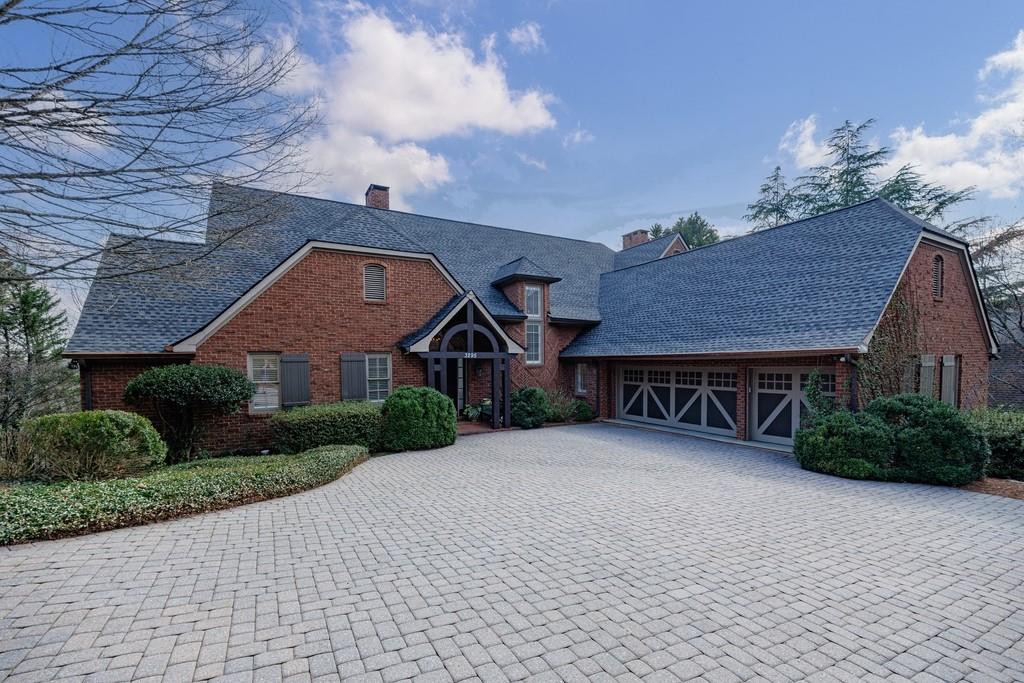 3295 Stillhouse Road Southeast Atlanta, GA 30339 - Photo 1 of 1 a front view of a house with a yard and garage