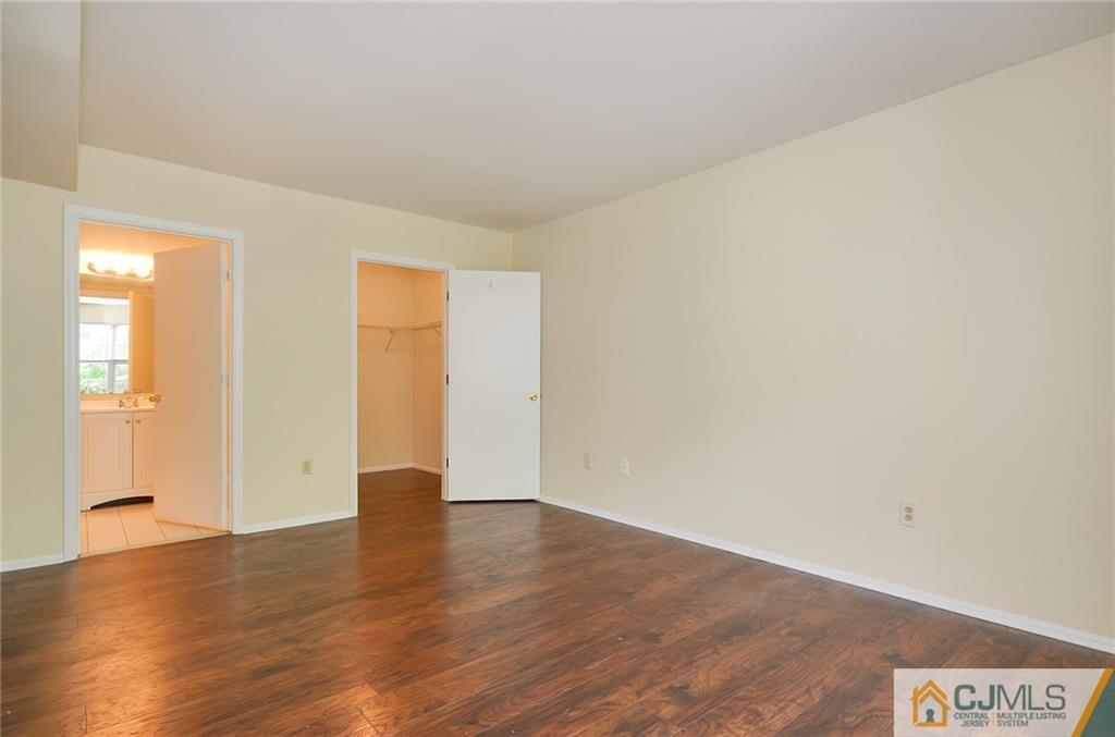 1401 Plymouth Road North Brunswick, NJ 08902 - Photo 15 of 25 a view of an empty room with wooden floor