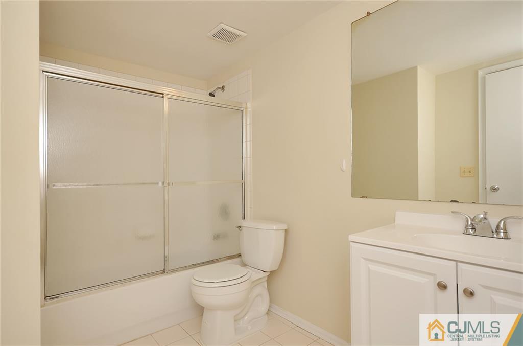 1401 Plymouth Road North Brunswick, NJ 08902 - Photo 21 of 25 a bathroom with a toilet a sink and a shower
