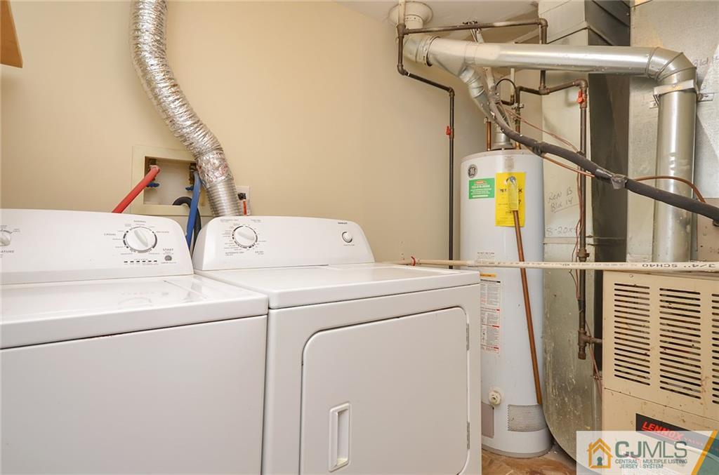 1401 Plymouth Road North Brunswick, NJ 08902 - Photo 22 of 25 a utility room with dryer and washer
