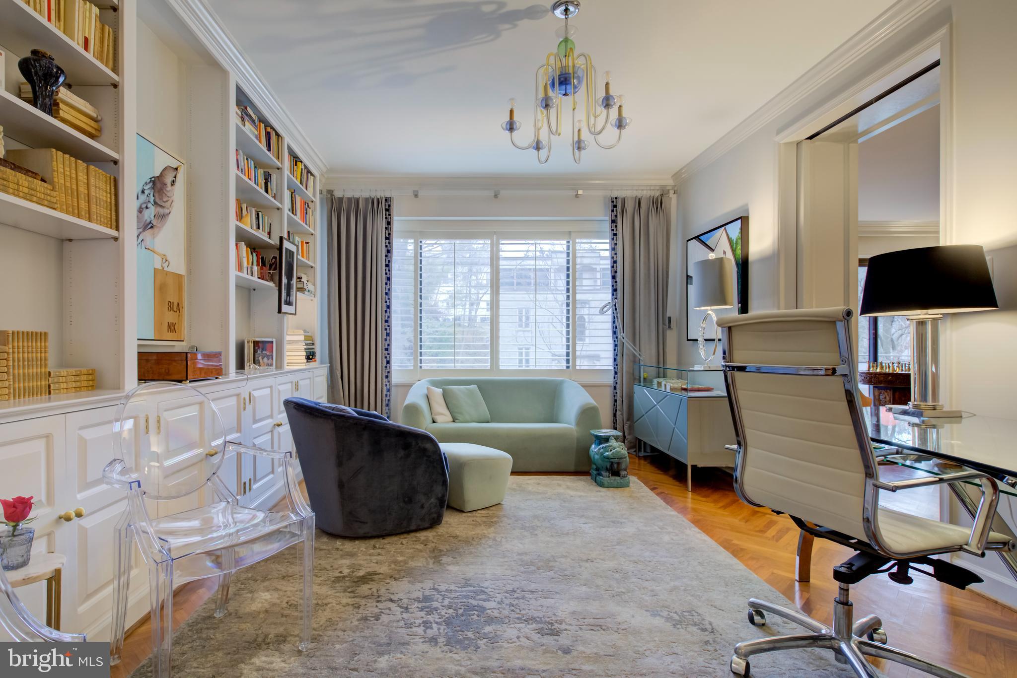 2700 Calvert Street Northwest, Unit 217 Washington, DC 20008 - Photo 11 of 36 a living room with furniture and a flat screen tv