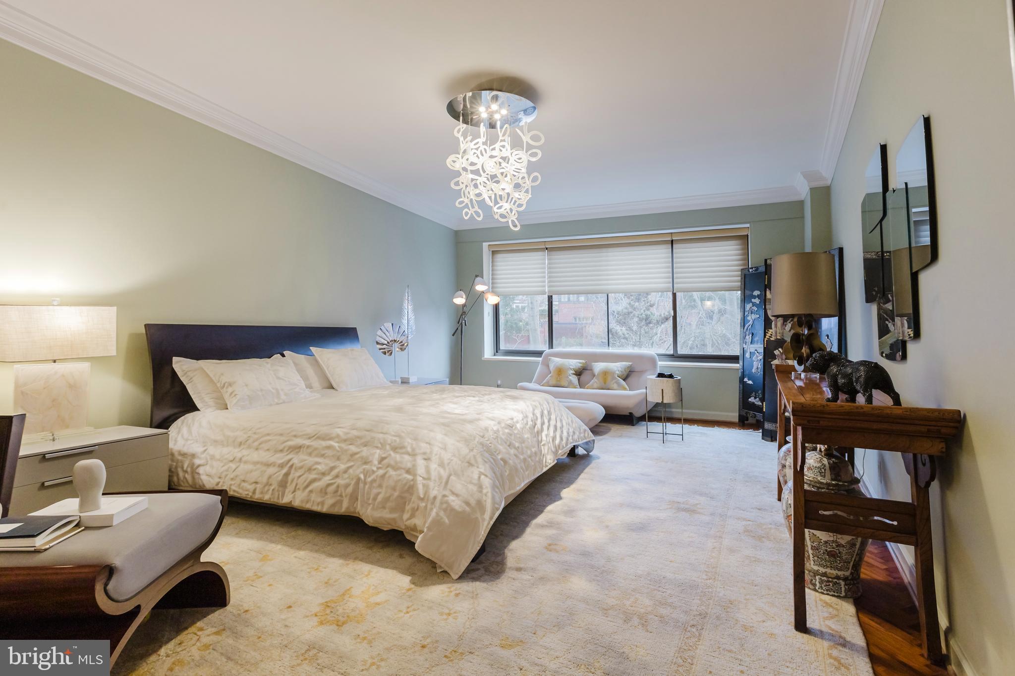 2700 Calvert Street Northwest, Unit 217 Washington, DC 20008 - Photo 15 of 36 a bedroom with bed and a large window