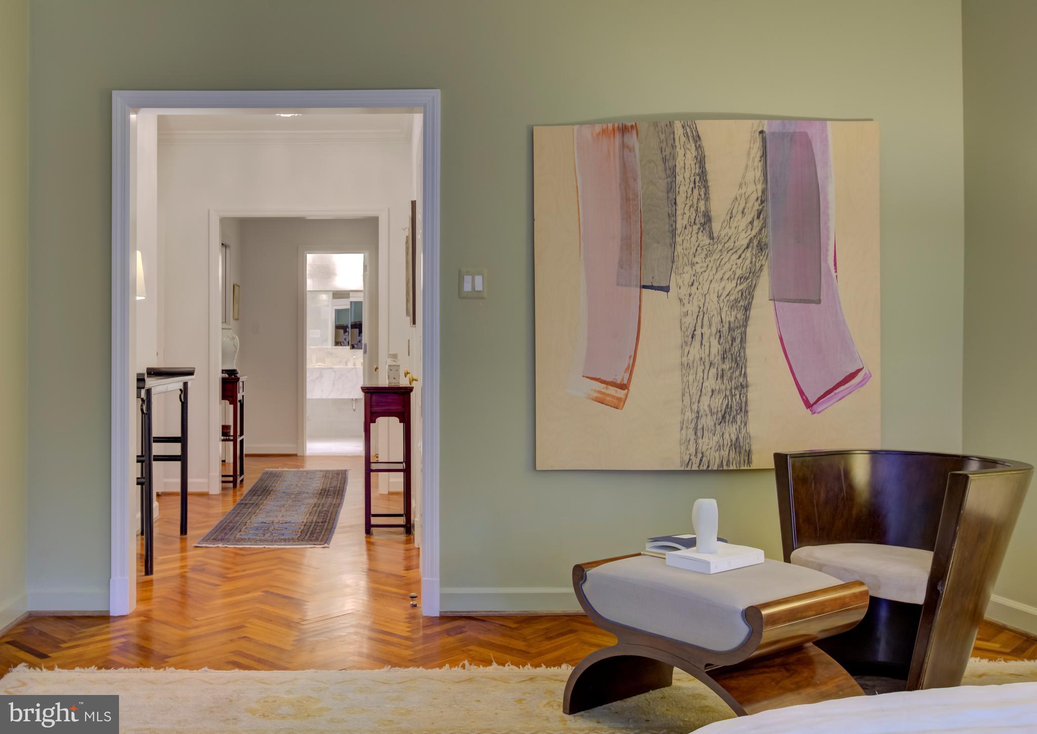 2700 Calvert Street Northwest, Unit 217 Washington, DC 20008 - Photo 17 of 36 a living room with furniture and wooden floor