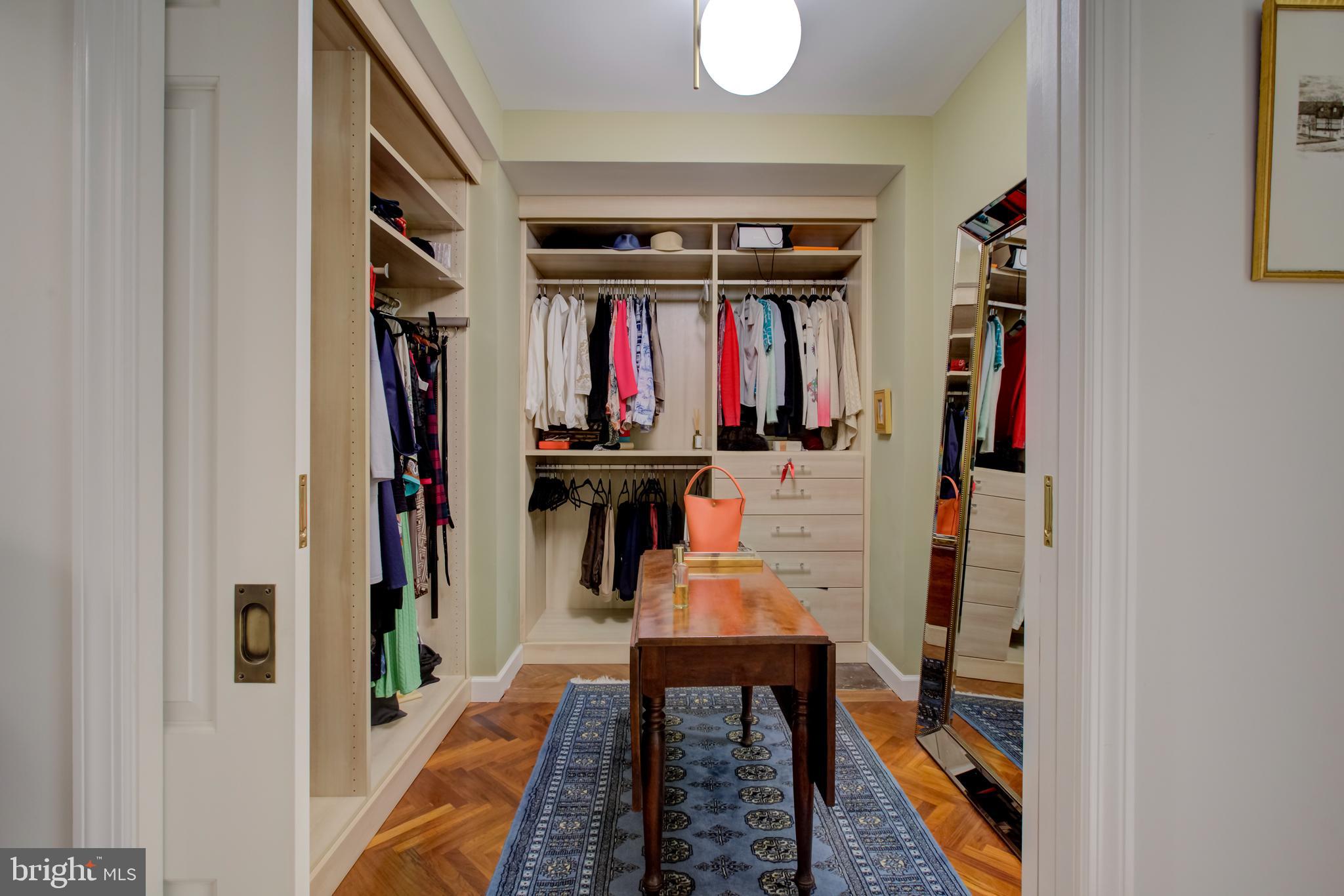 2700 Calvert Street Northwest, Unit 217 Washington, DC 20008 - Photo 19 of 36 walk in closet with clothes and shoes