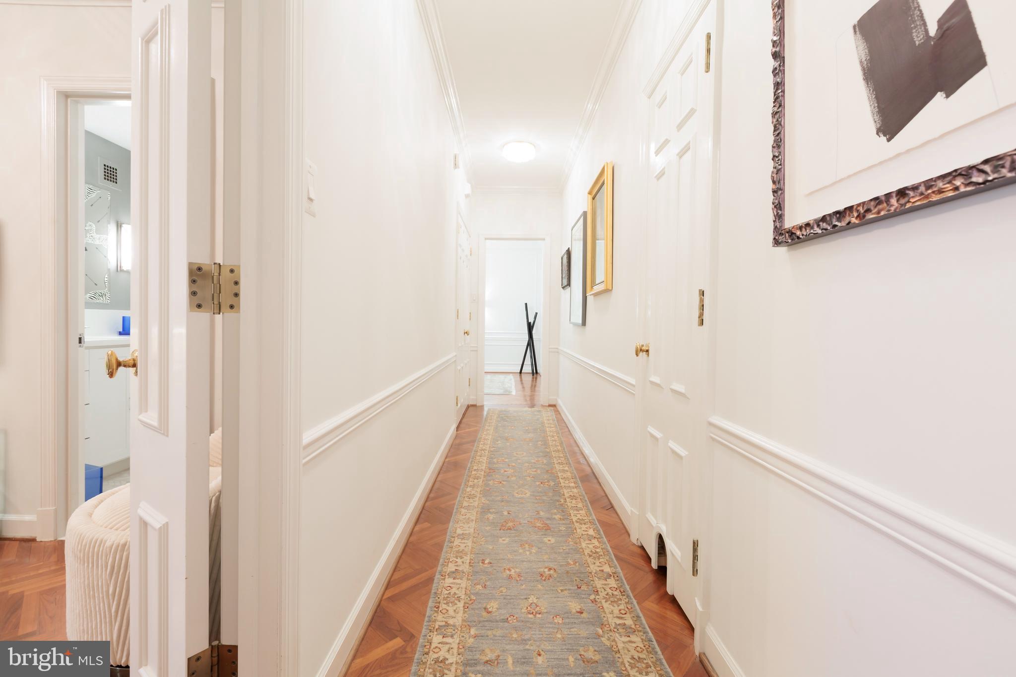 2700 Calvert Street Northwest, Unit 217 Washington, DC 20008 - Photo 23 of 36 a view of a hallway with white walls and stairs