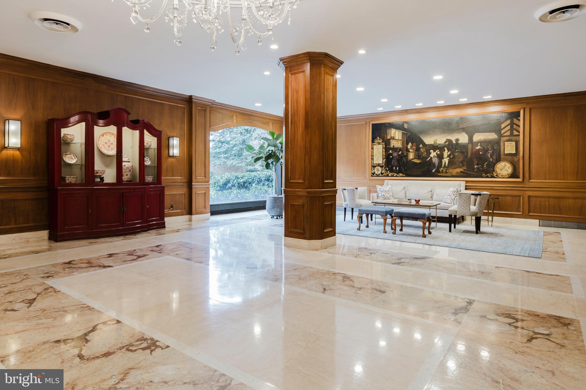 2700 Calvert Street Northwest, Unit 217 Washington, DC 20008 - Photo 27 of 36 a view of a lobby with furniture and a floor to ceiling window