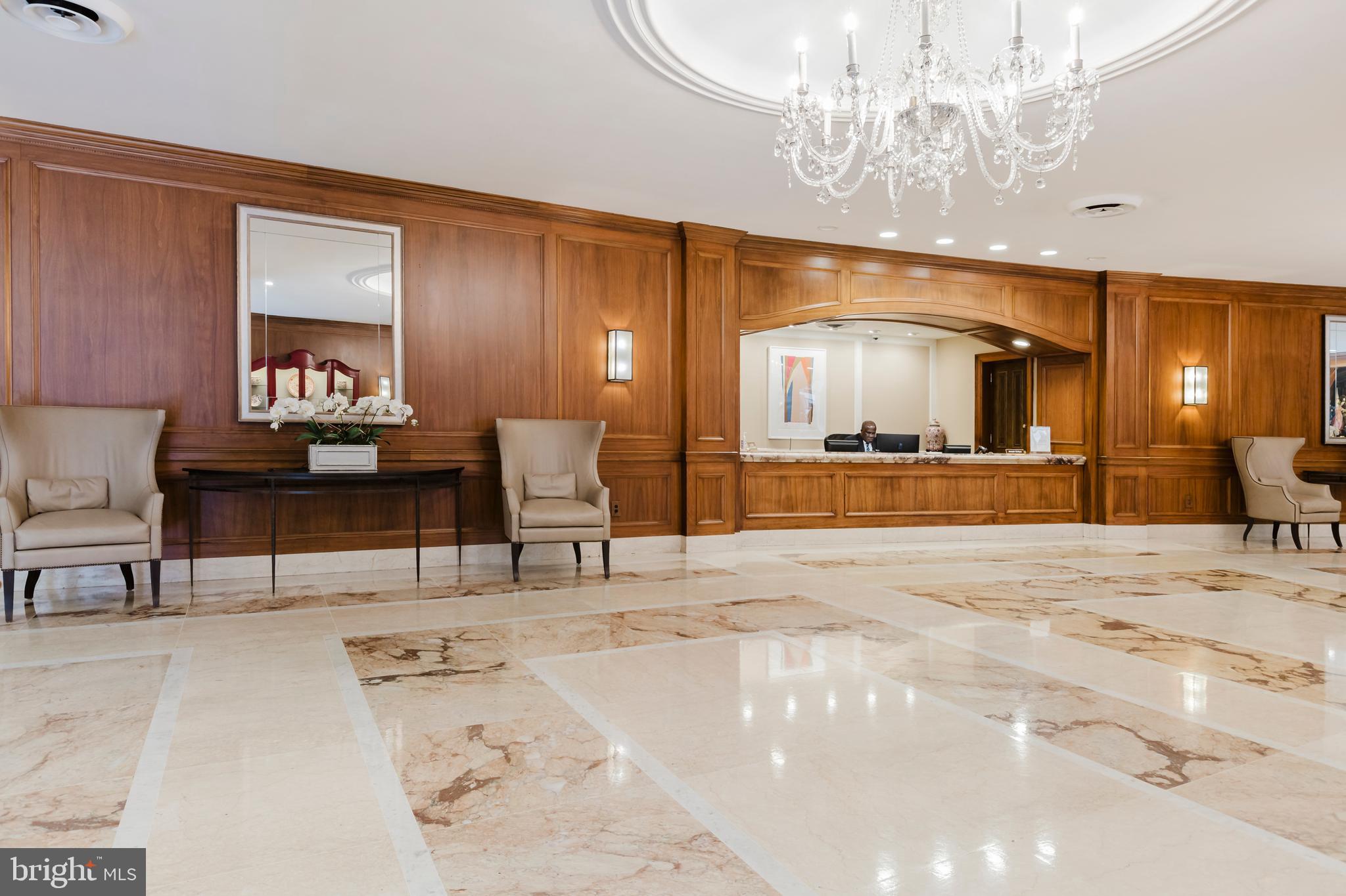 2700 Calvert Street Northwest, Unit 217 Washington, DC 20008 - Photo 28 of 36 a bedroom with a bed and a chandelier