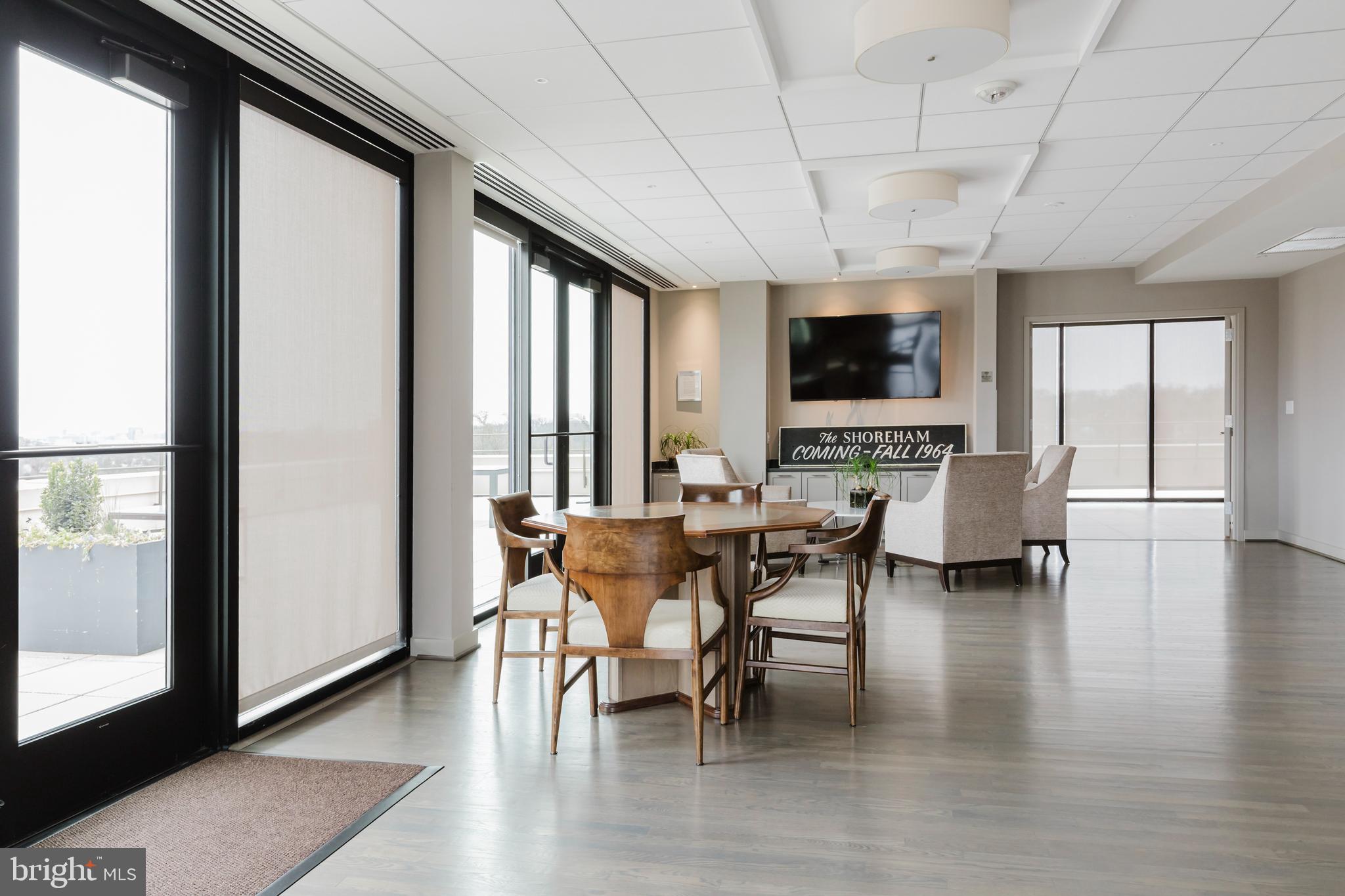 2700 Calvert Street Northwest, Unit 217 Washington, DC 20008 - Photo 30 of 36 a view of a dining room with furniture and wooden floor