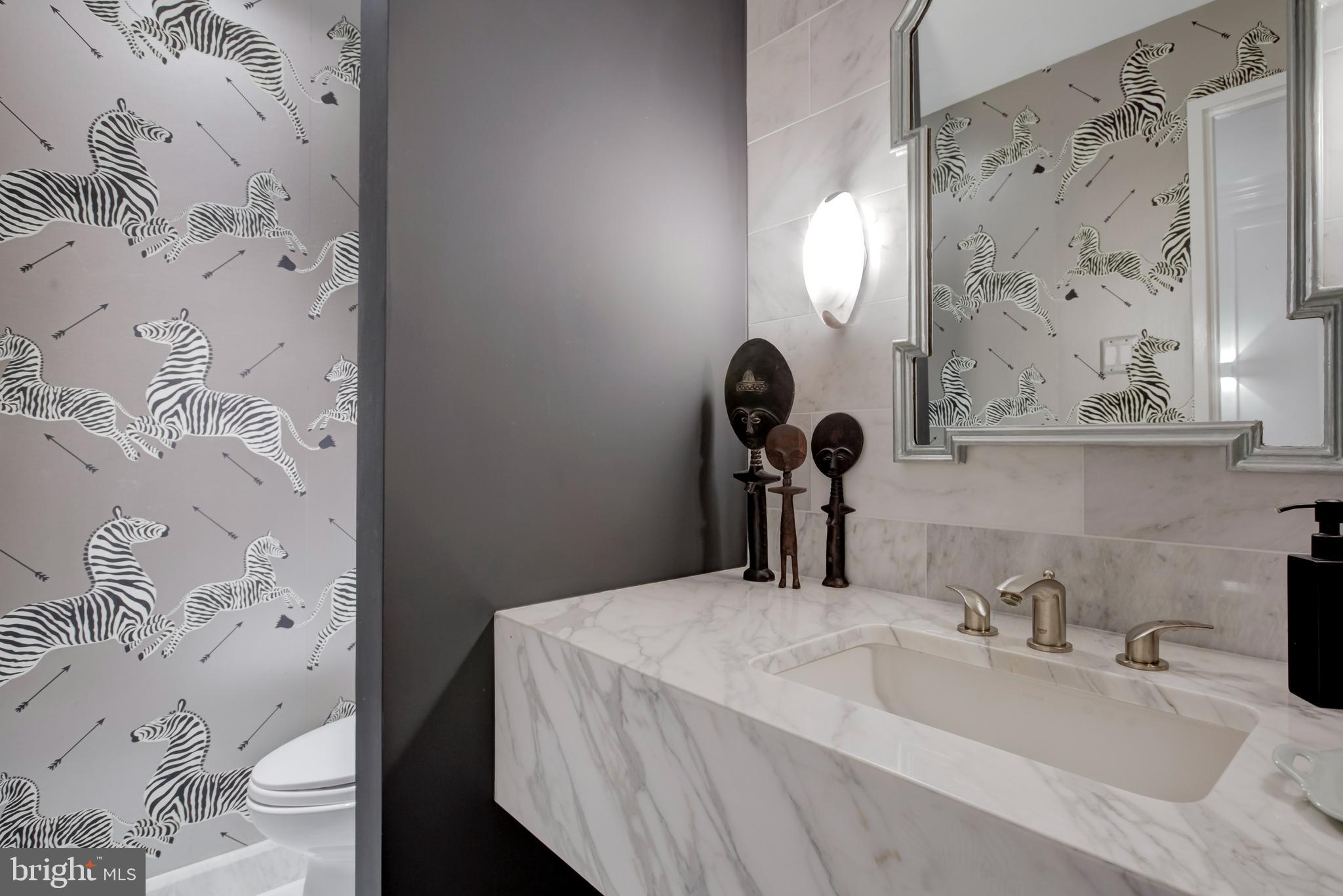 2700 Calvert Street Northwest, Unit 217 Washington, DC 20008 - Photo 4 of 36 a bathroom with a sink and a mirror