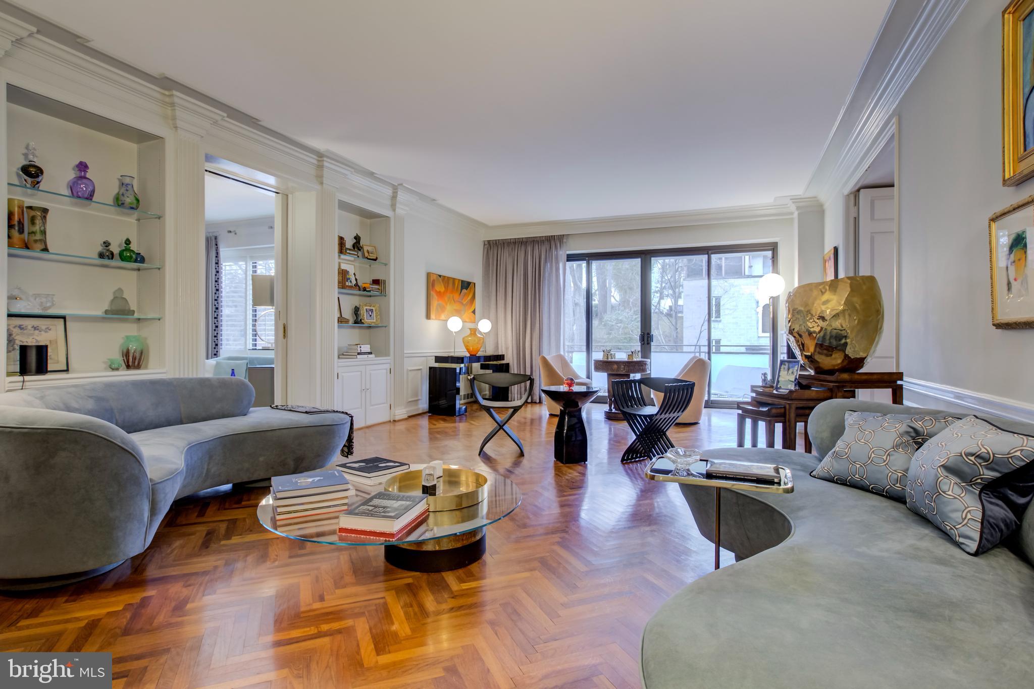 2700 Calvert Street Northwest, Unit 217 Washington, DC 20008 - Photo 9 of 36 a living room with furniture and wooden floor