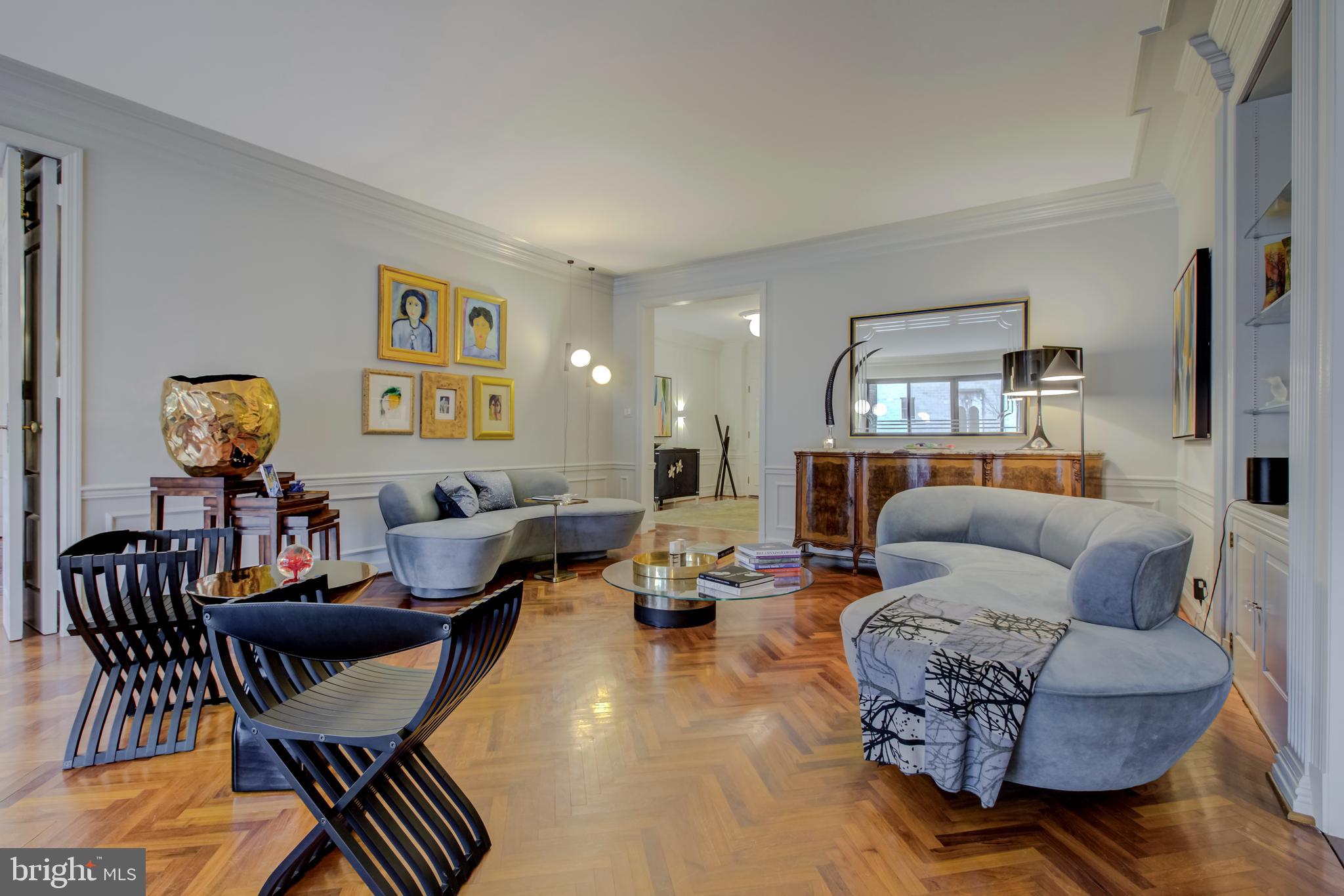 2700 Calvert Street Northwest, Unit 217 Washington, DC 20008 - Photo 10 of 36 a living room with furniture and wooden floor