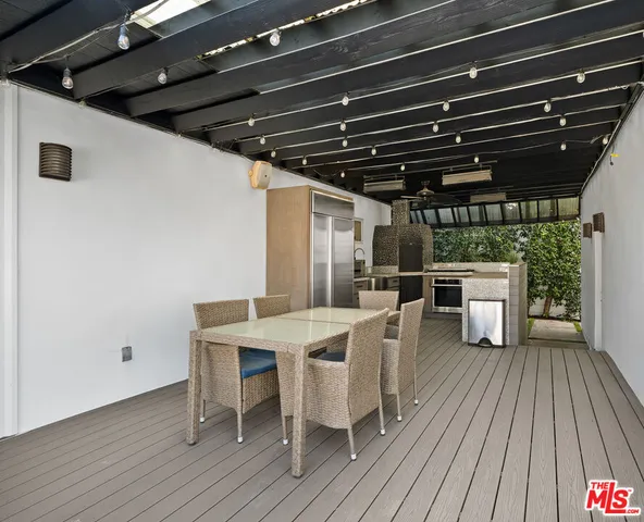 a view of a chairs and table on the wooden floor