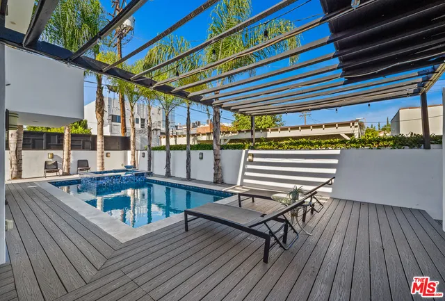 a view of a patio with a table and chairs