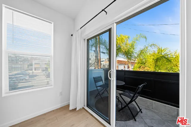 a view of a room with a furniture and a window