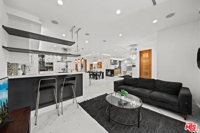 a living room with furniture and a table