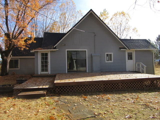 40905 Brown Road Fall River Mills, CA 96028 - Photo 1 of 24 a front view of a house with a yard