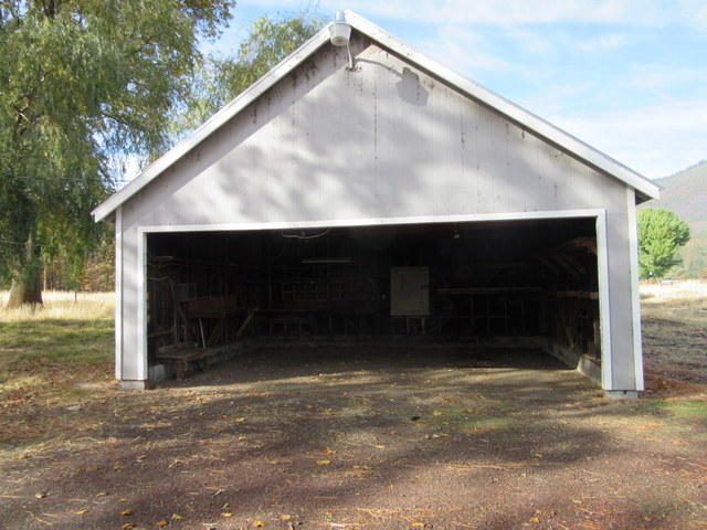 40905 Brown Road Fall River Mills, CA 96028 - Photo 9 of 24 a front view of a house with a garage