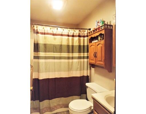 26 Corey Road Ashburnham, MA 01430 - Photo 4 of 8 a bathroom with a toilet a sink and a shower