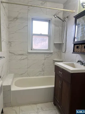 a bathroom with a sink and a bathtub