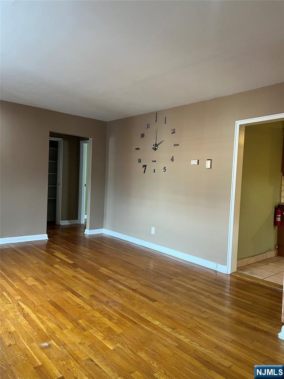 715 Broad Avenue, Unit 2A Ridgefield, NJ 07657 - Photo 6 of 12 a view of an empty room with wooden floor