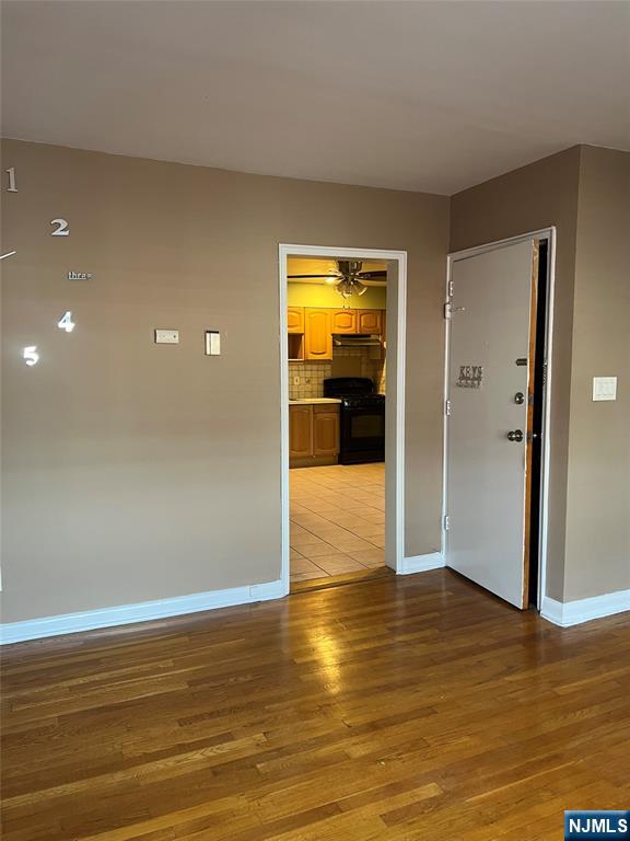 715 Broad Avenue, Unit 2A Ridgefield, NJ 07657 - Photo 10 of 12 a view of empty room with wooden floor