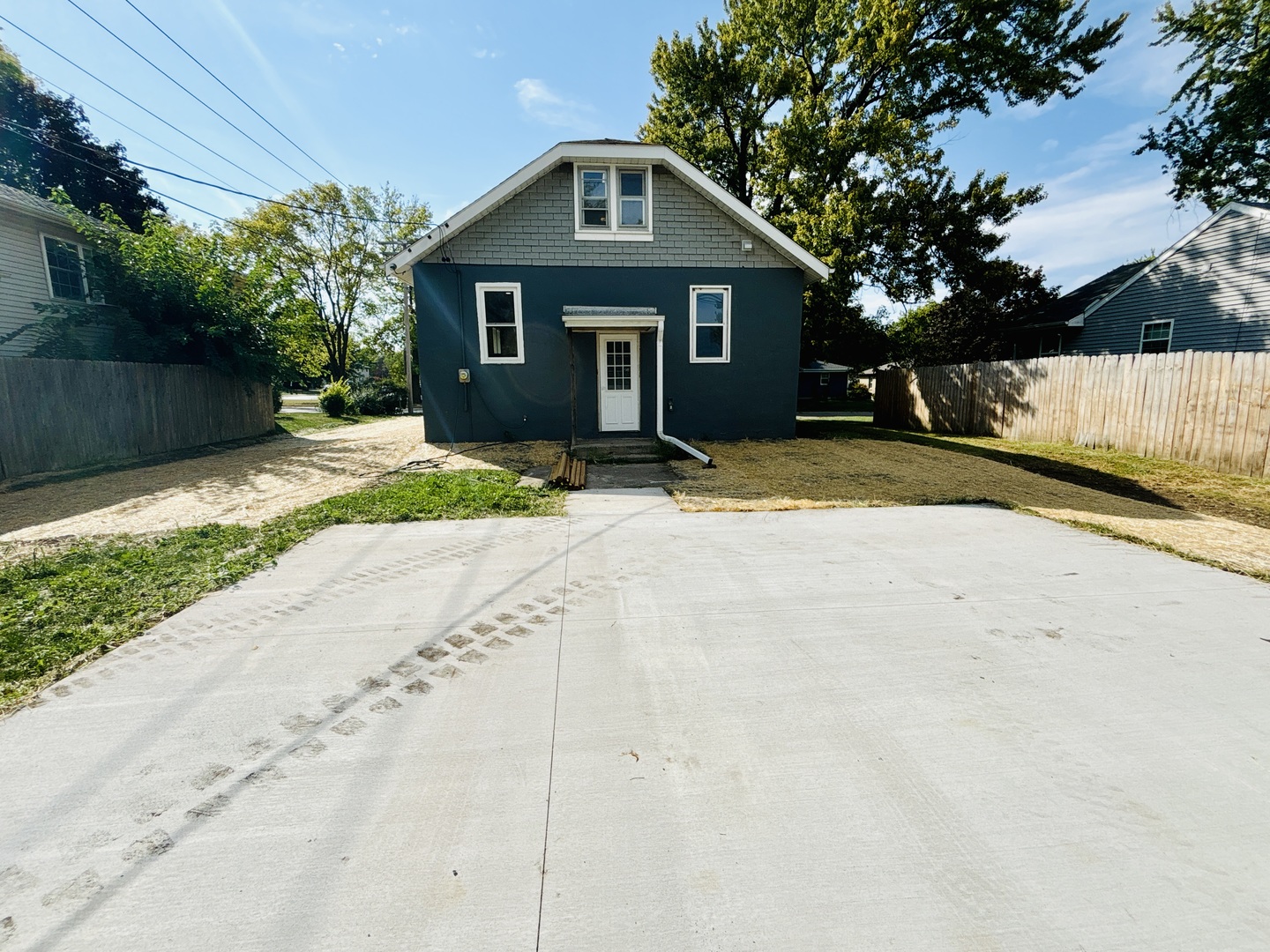 1002 Adams Street Ottawa, IL 61350 - Photo 14 of 14 a front view of a house with a yard and garage