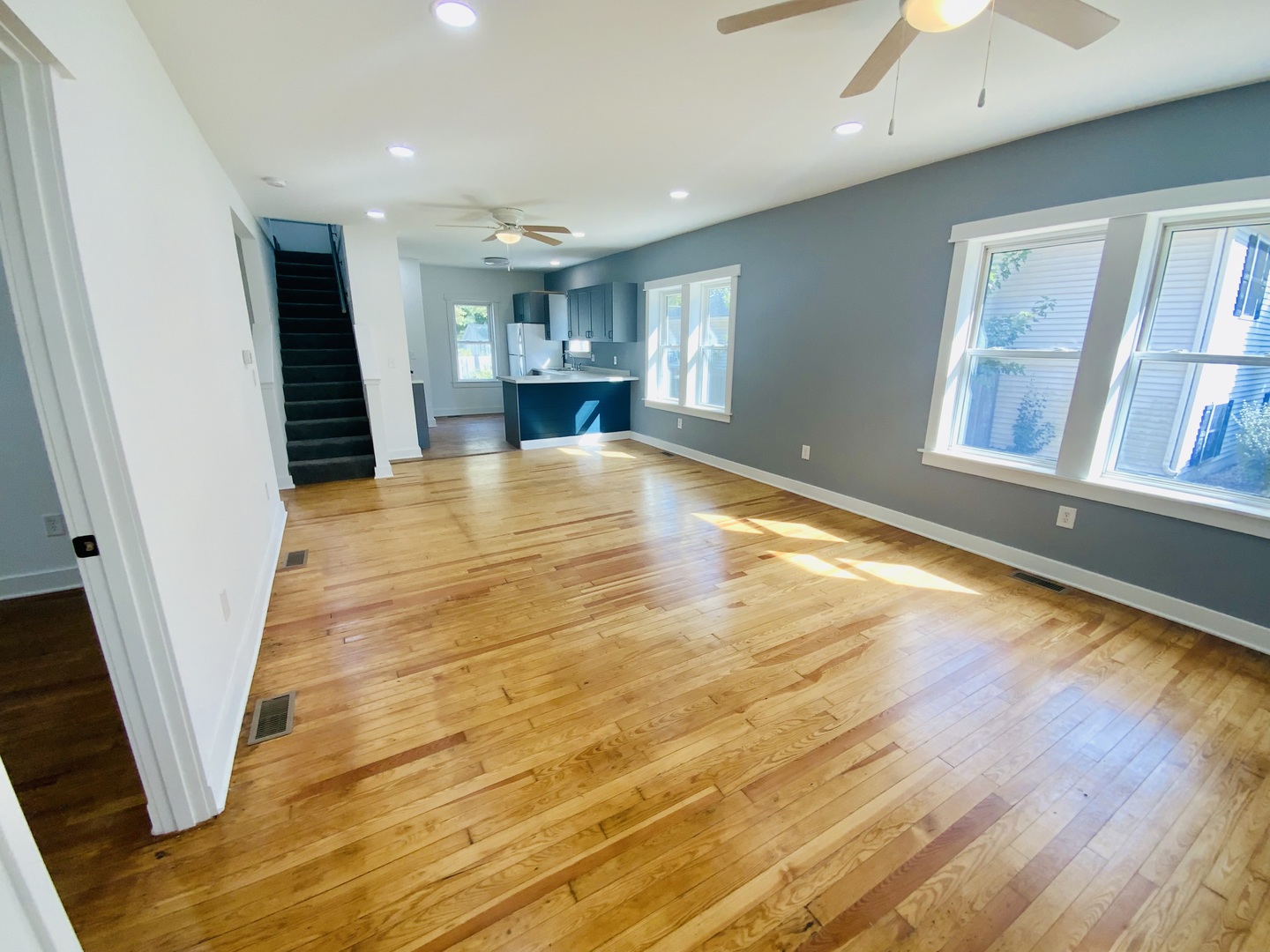 1002 Adams Street Ottawa, IL 61350 - Photo 4 of 14 a view of empty room with wooden floor and window
