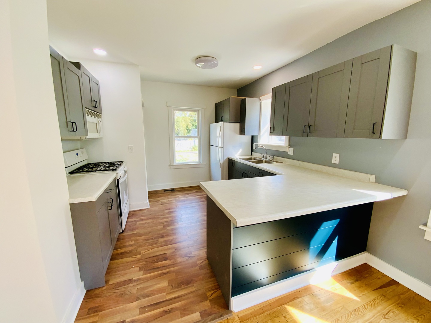 1002 Adams Street Ottawa, IL 61350 - Photo 5 of 14 a kitchen with a appliances cabinets and a counter top space