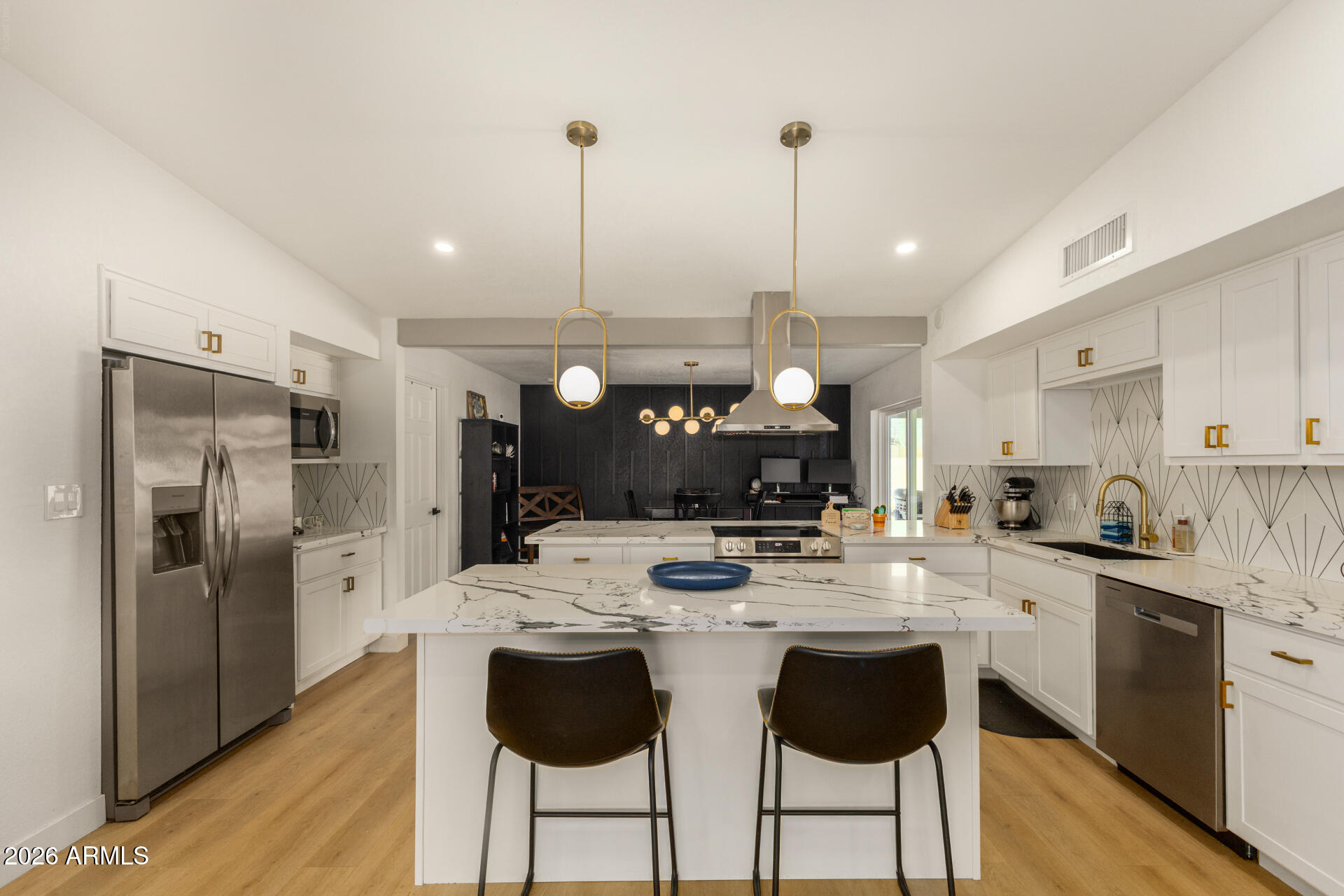 1560 North Freeman Mesa, AZ 85201 - Photo 2 of 22 a kitchen with refrigerator cabinets and wooden floor