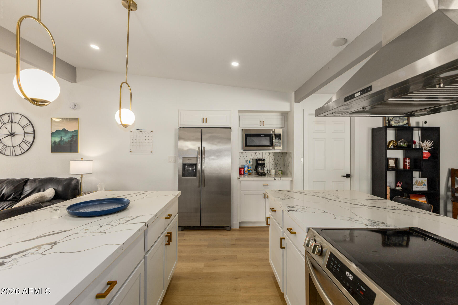 1560 North Freeman Mesa, AZ 85201 - Photo 4 of 22 a kitchen with stainless steel appliances granite countertop a sink a stove and a refrigerator