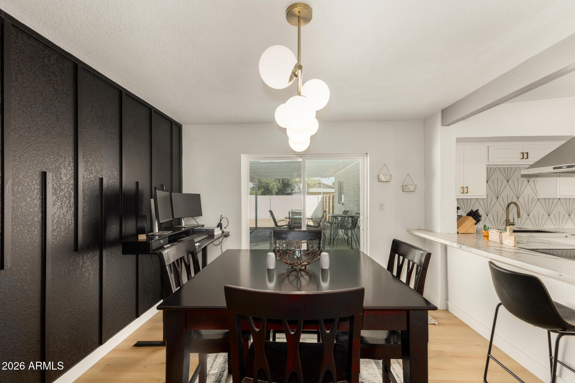 1560 North Freeman Mesa, AZ 85201 - Photo 6 of 22 a view of a dining room with furniture a chandelier and wooden floor