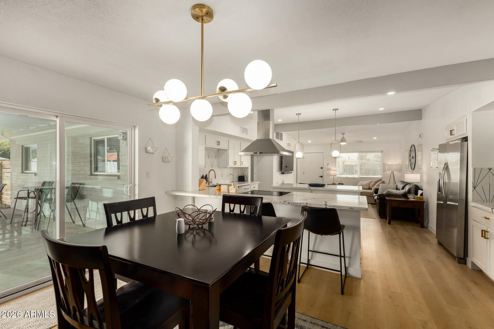 1560 North Freeman Mesa, AZ 85201 - Photo 8 of 22 a large kitchen with a table and chairs