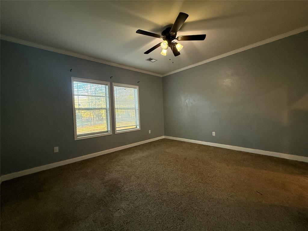 159 Yellow Pine Road Sibley, LA 71073 - Photo 17 of 33 an empty room with a window and a fan