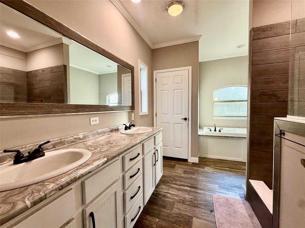 159 Yellow Pine Road Sibley, LA 71073 - Photo 20 of 33 a bathroom with a sink a mirror and a shower