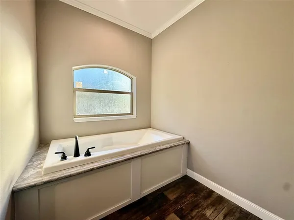 a room with a bed and a window