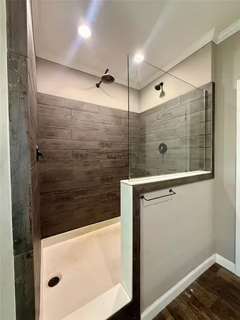 a bathroom with a shower and a mirror