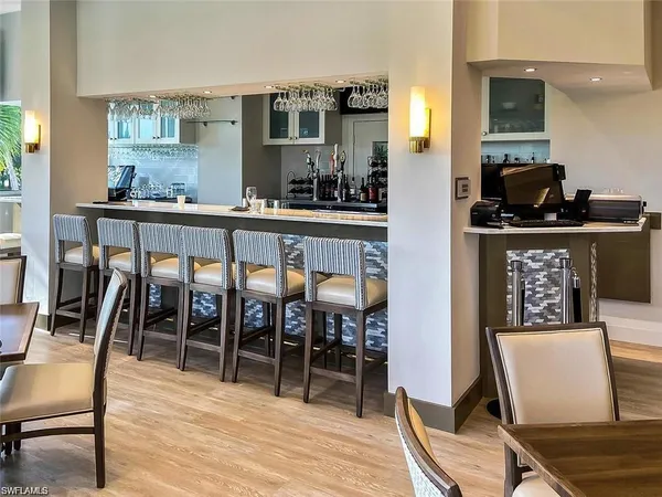 a dining room with furniture and wooden floor