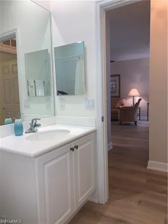 a en suite bathroom with a sink and a mirror