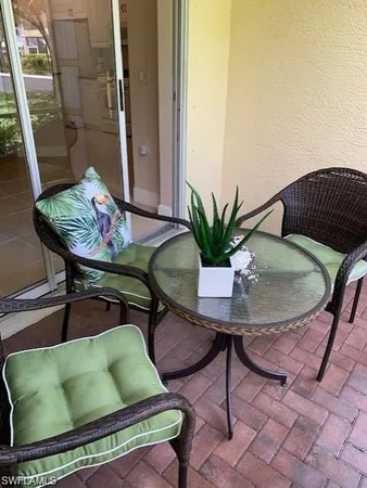 a backyard with table and chairs