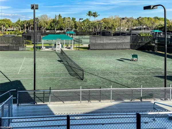 a swimming pool with some trees in the background