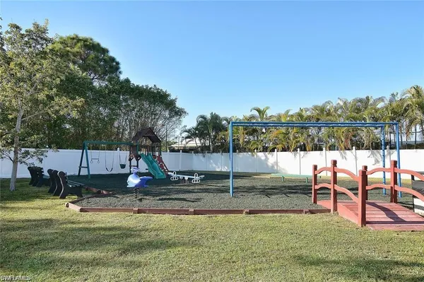 a view of a park with swings