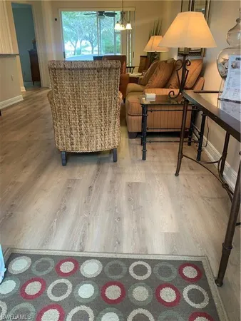 a living room with furniture and a rug