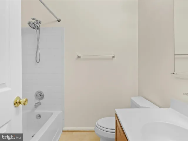 a bathroom with a bathtub and toilet