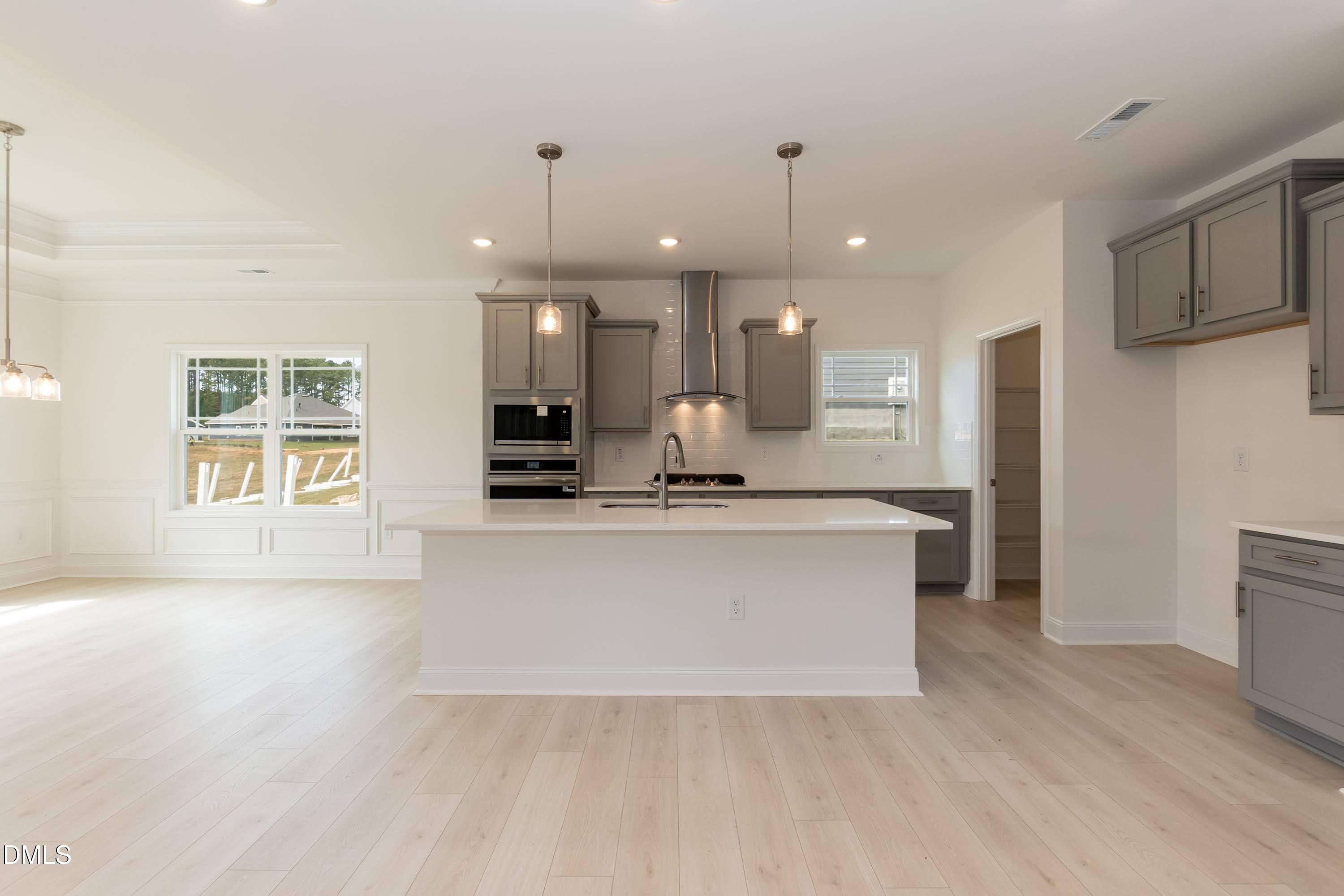 254 Galway Road Lillington, NC 27546 - Photo 10 of 35 a large white kitchen with a large window