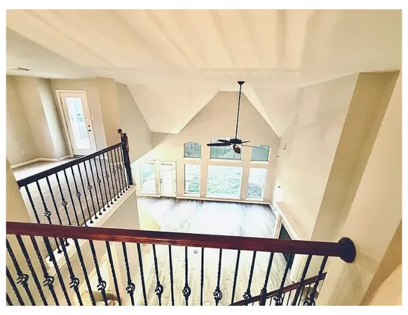 a view of a hallway view with staircase