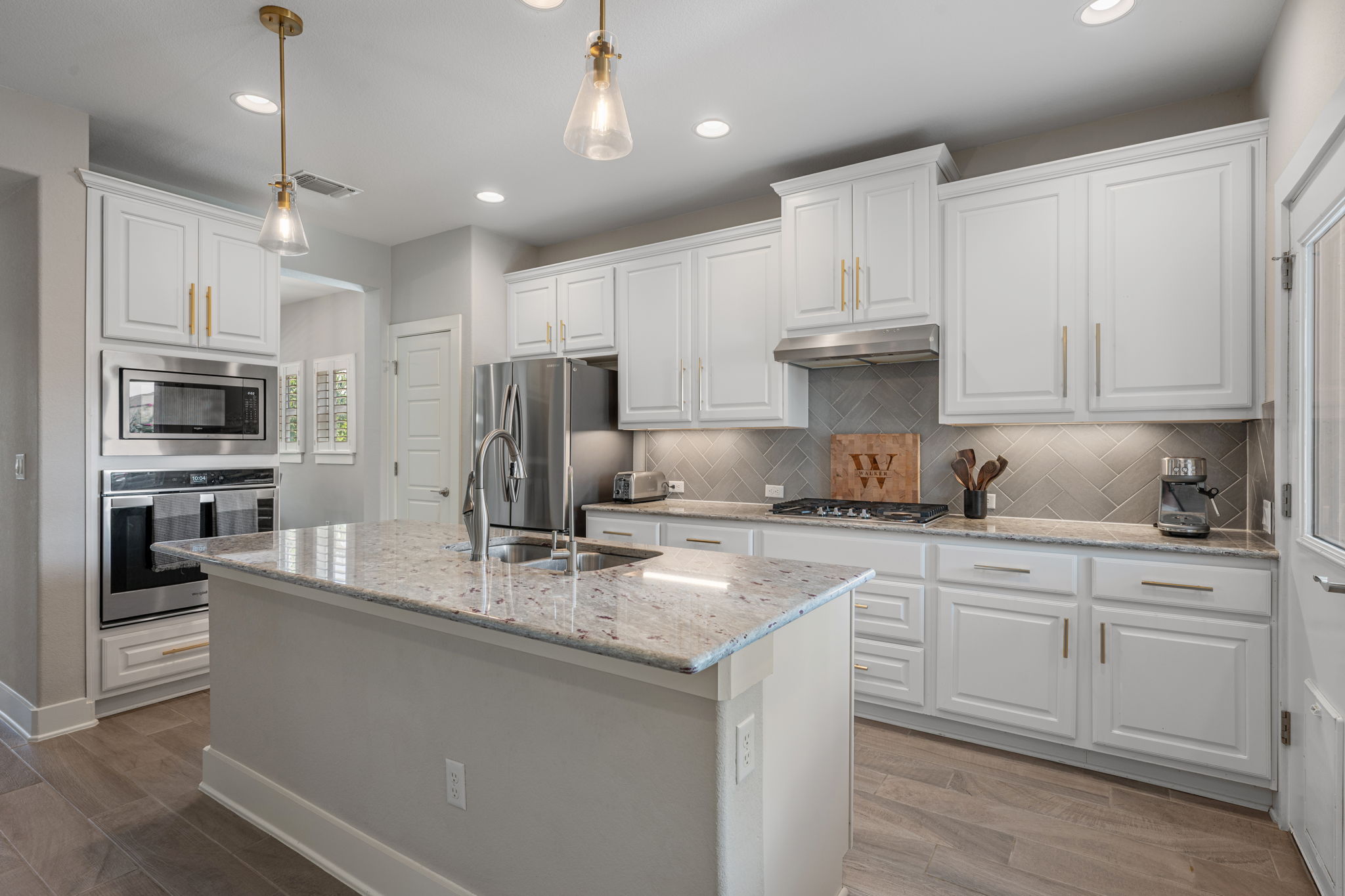 5409 Fox Wing Way Austin, TX 78747 - Photo 5 of 26 Culinary delights await in this modern kitchen with pristine counters and bright recessed lighting.