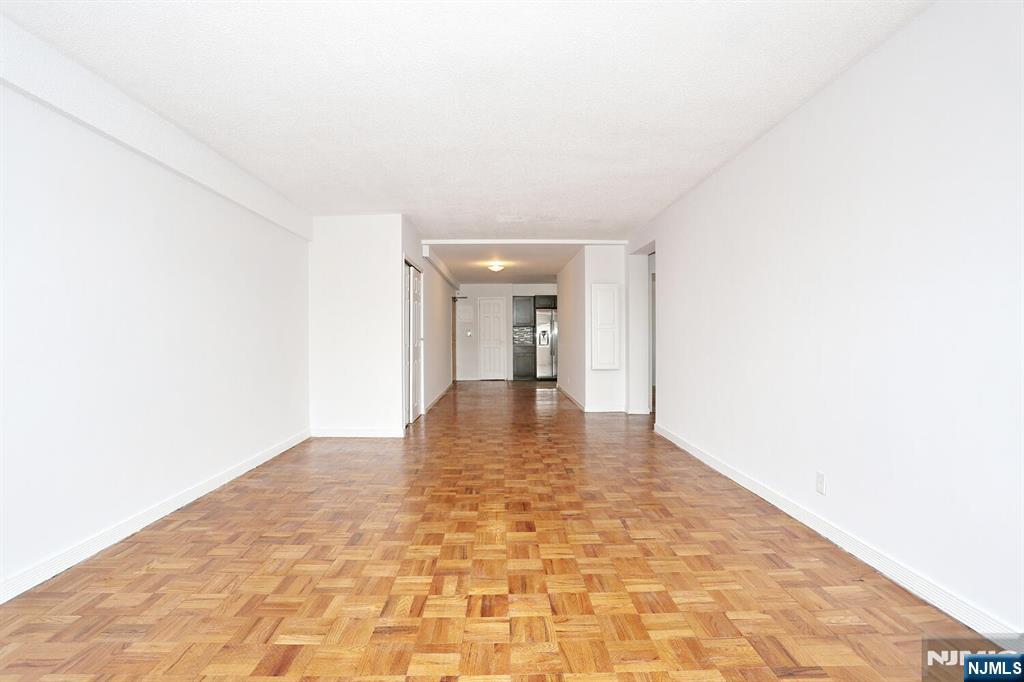 208 Anderson Street, Unit S4F Hackensack, NJ 07601 - Photo 8 of 18 a view of a hallway with a window